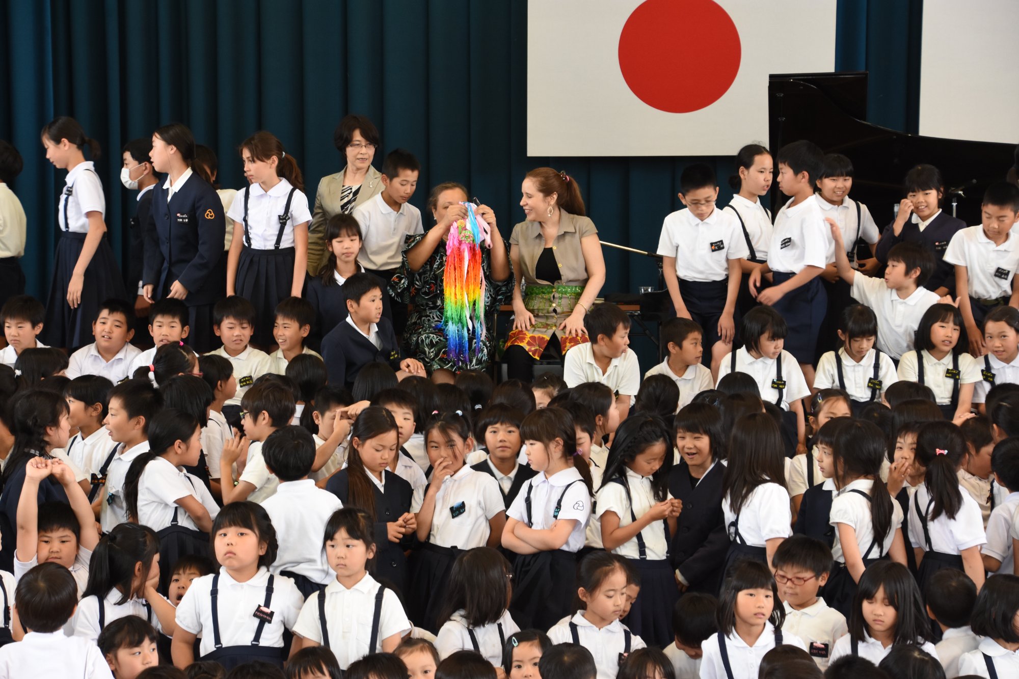 Patricia at piano, full orchestra and audience