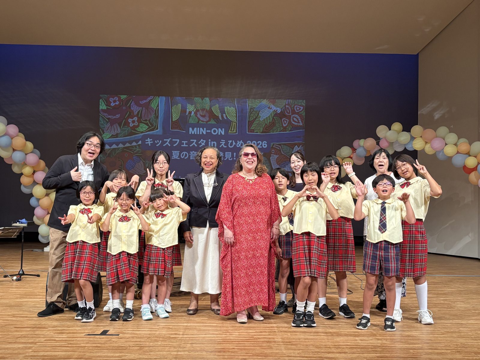 Patricia Vlieg and Vilma Esquivel on stage with the Himawari Children's and Youth Choir